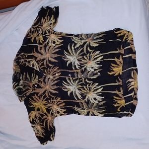 Caribbean blues is the brand, it is a Medium men's shirt.